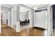 Inviting foyer with hardwood floors, white trim, and a view into the dining room, creating a welcoming entrance at 14492 Allison Dr, Carmel, IN 46033
