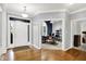 Lovely foyer with hardwood floors leading to an office and other living spaces, creating a warm and welcoming ambiance at 14492 Allison Dr, Carmel, IN 46033