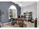 Bright home office features a large window, vaulted ceilings, and an industrial-style desk and shelving unit at 14492 Allison Dr, Carmel, IN 46033