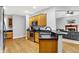 Spacious kitchen features wooden cabinetry, granite countertops, stainless steel appliances, and hardwood flooring at 14492 Allison Dr, Carmel, IN 46033