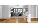 Spacious living room boasts hardwood floors and an open floor plan leading to the outdoor patio and dining area at 14492 Allison Dr, Carmel, IN 46033
