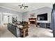 Bright living room featuring a fireplace and large windows that provide views of the outdoor scenery at 14492 Allison Dr, Carmel, IN 46033