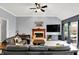 Comfortable living room with a fireplace and outdoor patio access creating a relaxing atmosphere at 14492 Allison Dr, Carmel, IN 46033