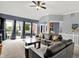 Comfortable living room with neutral carpet, and access to a patio provides a welcoming and relaxed atmosphere at 14492 Allison Dr, Carmel, IN 46033