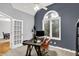 Stylish office with a pitched ceiling, modern desk, and large window, designed for productivity and comfort at 14492 Allison Dr, Carmel, IN 46033