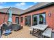 Relaxing brick patio featuring cozy seating, a dining table, and outdoor access at 14492 Allison Dr, Carmel, IN 46033
