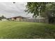 Lush backyard with a wooden fence, perfect for outdoor activities and privacy at 1601 Southern Ave, Beech Grove, IN 46107