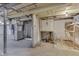 Spacious unfinished basement offers potential, featuring exposed ductwork, and concrete flooring at 1601 Southern Ave, Beech Grove, IN 46107