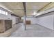 Unfinished basement offers ample space, with support beams and exposed ceiling, ready for personalization at 1601 Southern Ave, Beech Grove, IN 46107