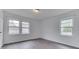 Bedroom featuring hardwood floors and two windows with natural light at 1601 Southern Ave, Beech Grove, IN 46107