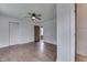 Spacious bedroom with hardwood floors, ceiling fan, and closet at 1601 Southern Ave, Beech Grove, IN 46107