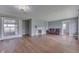 Spacious living room with hardwood floors, a fireplace, and great natural light at 1601 Southern Ave, Beech Grove, IN 46107