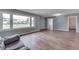 Bright living room with hardwood floors, large window, and ample natural light at 1601 Southern Ave, Beech Grove, IN 46107