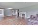 Cozy living room with hardwood floors, a fireplace and grey walls at 1601 Southern Ave, Beech Grove, IN 46107