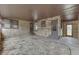 Enclosed sunroom with natural stone walls and multiple access doors to the outdoors at 1601 Southern Ave, Beech Grove, IN 46107
