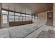Sunroom featuring a full wall of windows and natural stone accents at 1601 Southern Ave, Beech Grove, IN 46107