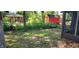 Shaded backyard featuring a chain link fence and foliage visible from screened porch at 1619 Crest Ct, Indianapolis, IN 46214