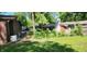 Image showing exterior details, sheds, chimney, and a fenced-in area, capturing the home's backyard setting at 1619 Crest Ct, Indianapolis, IN 46214