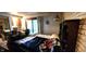 Bedroom features a sliding glass door and wood furniture at 1619 Crest Ct, Indianapolis, IN 46214