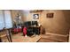 A room with a desk setup, carpet, and a window with blinds at 1619 Crest Ct, Indianapolis, IN 46214