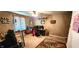 Bedroom showcasing carpeted floor, computer, and decorated walls and shelves at 1619 Crest Ct, Indianapolis, IN 46214
