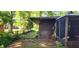 Exterior showcasing yard, foliage, screen porch, and backyard elements of the home in a residential setting at 1619 Crest Ct, Indianapolis, IN 46214