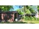 Image showing exterior details, sheds, chimney, and a fenced-in area, capturing the home's backyard setting at 1619 Crest Ct, Indianapolis, IN 46214
