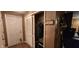 Hallway with utility closet and an open closet with clothes at 1619 Crest Ct, Indianapolis, IN 46214