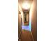 Neutral hallway with carpeted floors leading to multiple rooms and doorways at 1619 Crest Ct, Indianapolis, IN 46214