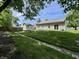 Beautiful backyard featuring a shed, lush green grass, and a treeline on a sunny day at 167 Hilltop Farms Blvd, New Whiteland, IN 46184