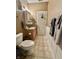 Cozy bathroom with vanity, sink, mirror, toilet, and convenient towel storage at 167 Hilltop Farms Blvd, New Whiteland, IN 46184