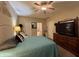 Comfortable bedroom featuring a ceiling fan, and a TV on a dresser at 167 Hilltop Farms Blvd, New Whiteland, IN 46184