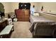 This bedroom has a single bed, a dresser, carpeted floors, and a dark accent wall at 167 Hilltop Farms Blvd, New Whiteland, IN 46184