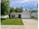 Inviting front exterior with lush green lawn and attached two-car garage at 167 Hilltop Farms Blvd, New Whiteland, IN 46184