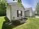Side exterior showcasing the nice yard, with well-maintained landscaping around the home at 167 Hilltop Farms Blvd, New Whiteland, IN 46184
