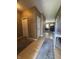 Inviting hallway with hardwood floors, leading to the carpeted living area at 167 Hilltop Farms Blvd, New Whiteland, IN 46184