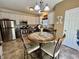 Bright kitchen featuring stainless steel appliances, a breakfast nook and stylish two-tone cabinetry at 167 Hilltop Farms Blvd, New Whiteland, IN 46184