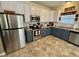 Kitchen boasting two-tone cabinetry, stainless steel appliances, and ample counter space at 167 Hilltop Farms Blvd, New Whiteland, IN 46184