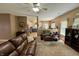 Open-concept living room showcasing a comfortable leather sofa and view into the kitchen at 167 Hilltop Farms Blvd, New Whiteland, IN 46184