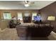 Spacious living room with cozy furniture, a ceiling fan, and bright natural light at 167 Hilltop Farms Blvd, New Whiteland, IN 46184
