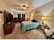 Spacious main bedroom featuring a ceiling fan, plush carpeting, and neutral decor at 167 Hilltop Farms Blvd, New Whiteland, IN 46184