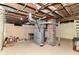 Unfinished basement featuring exposed ductwork, utilities, and brick column support at 1841 New St, Indianapolis, IN 46203