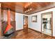 Dining room with a modern fireplace and view of updated kitchen appliances at 1841 New St, Indianapolis, IN 46203