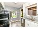 An updated kitchen features new cabinets and stainless steel appliances at 1841 New St, Indianapolis, IN 46203