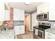 Updated kitchen with stainless steel appliances, granite countertops, and white cabinets at 1841 New St, Indianapolis, IN 46203