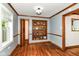 Living room with built-in shelves, wood floors, and wooden trim at 1841 New St, Indianapolis, IN 46203