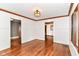 Spacious living room with hardwood floors and doorways leading to other rooms at 1841 New St, Indianapolis, IN 46203