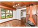 View of open living room with brick fireplace and wood flooring at 1841 New St, Indianapolis, IN 46203