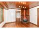 An open living room boasts hardwood floors, a unique fireplace, and wood ceiling at 1841 New St, Indianapolis, IN 46203