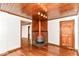 Open-concept living room features a unique fireplace, wood trim, and hardwood floors at 1841 New St, Indianapolis, IN 46203
